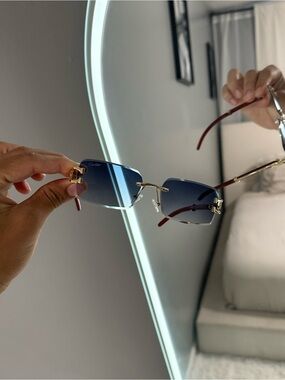 Cartier Rimless Blue Gradient Sunglasses with Gold Accents and Red Temples